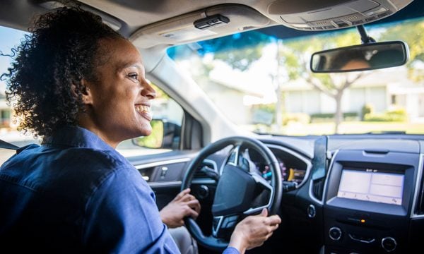woman at the wheel of a car